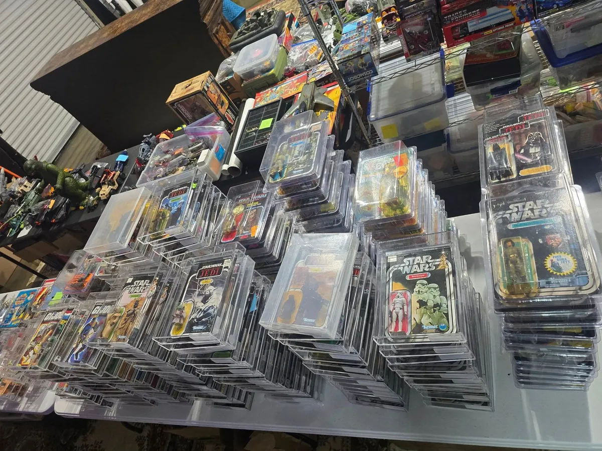 Shelves of carded vintage action figures at Ben's Toy Chest