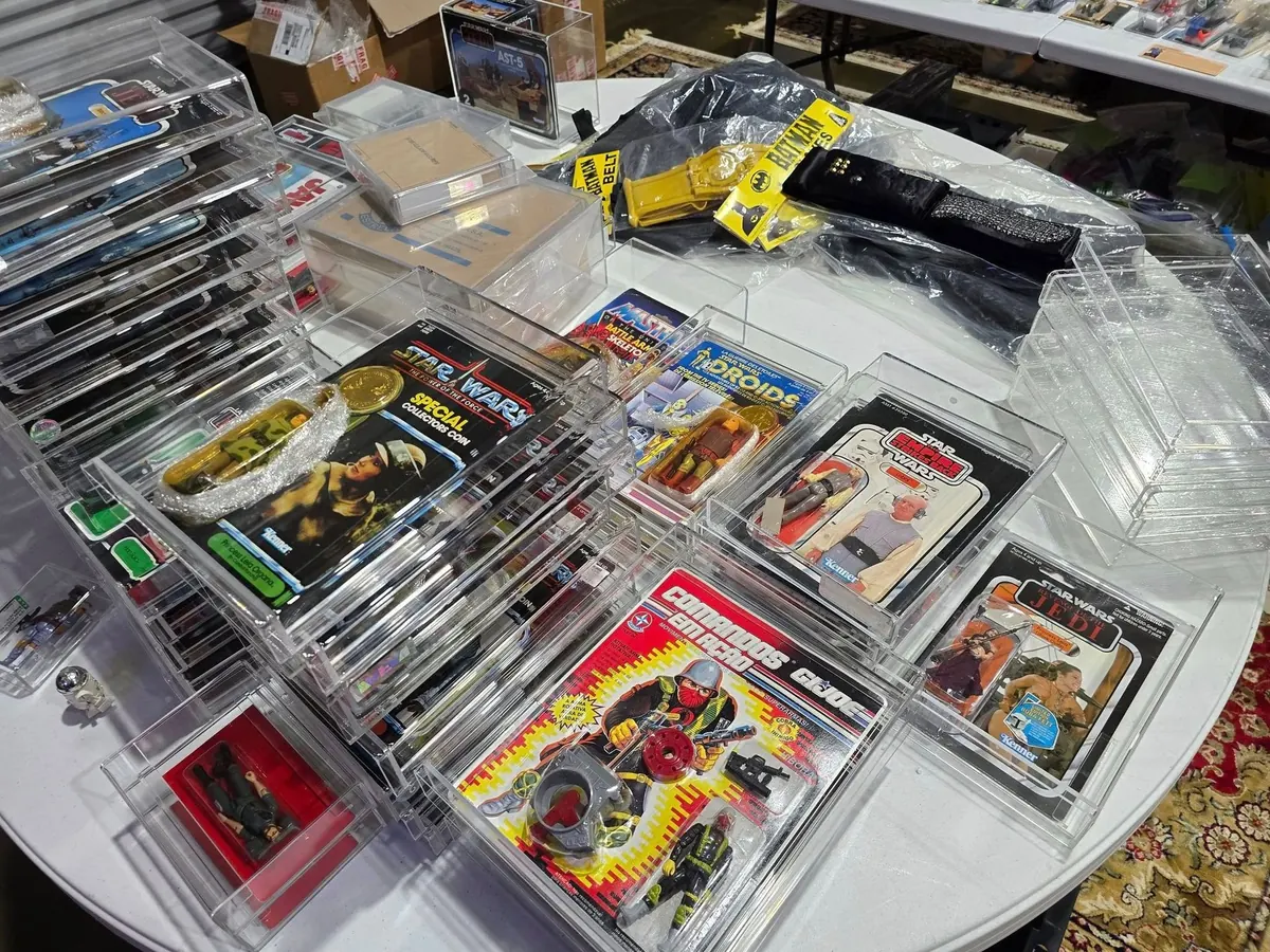 Bins of carded vintage action figures from several toy lines